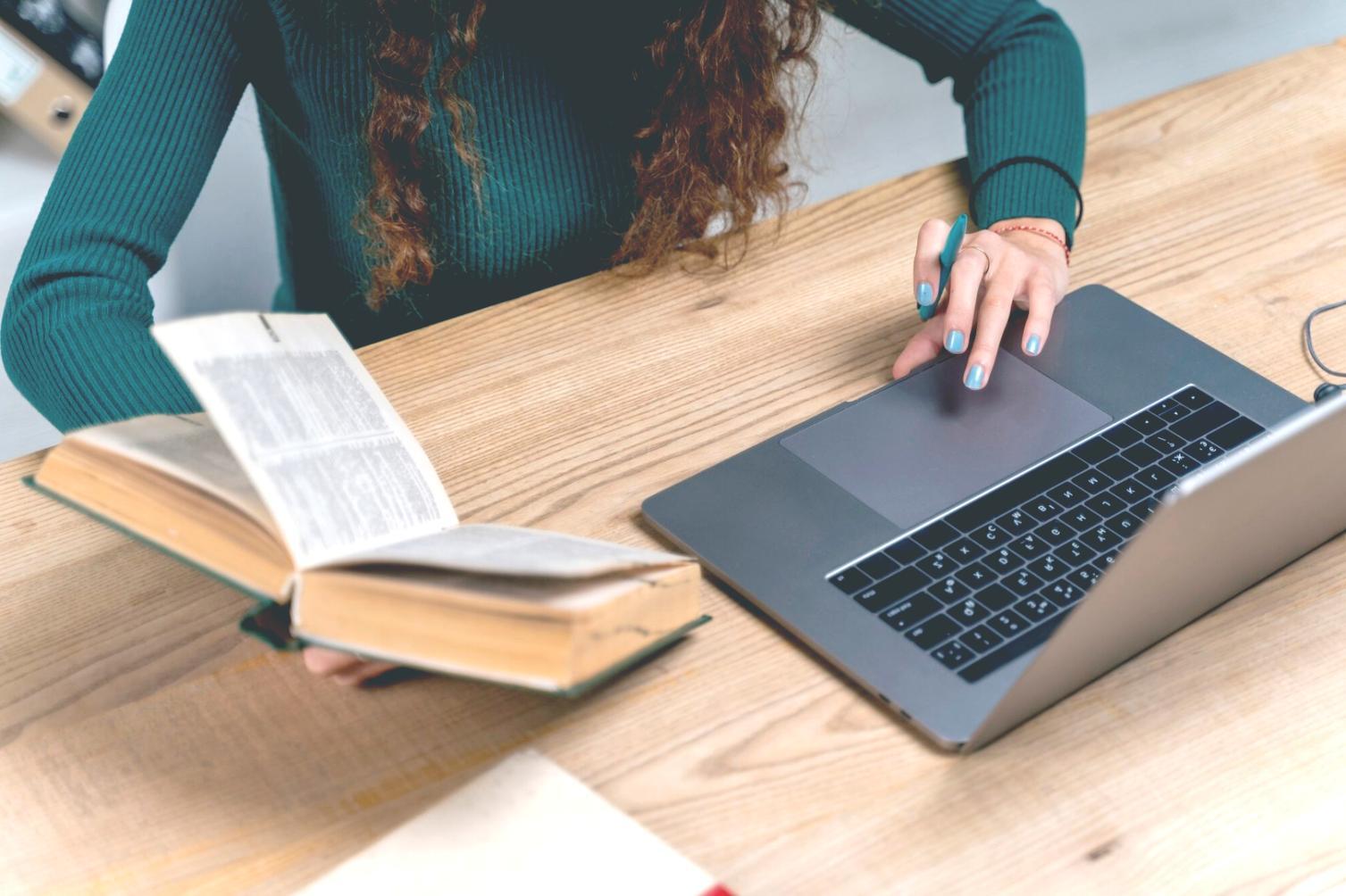 Financial analyst working on complex spreadsheet models with multiple monitors